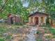 Backyard shed and outbuilding surrounded by overgrown vegetation at 1263 Dunbar St, Altamonte Springs, FL 32701
