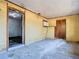 Room needs renovation with damaged walls, concrete floor, and an open doorway at 1263 Dunbar St, Altamonte Springs, FL 32701