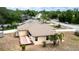 Backyard view showcasing the patio, shed, and mature trees at 1312 Catalina Blvd, Deltona, FL 32725