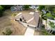 Home with a large driveway and landscaped front yard, in a well-maintained neighborhood at 1312 Catalina Blvd, Deltona, FL 32725