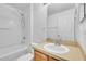 Bathroom features a tub and shower combination, and a vanity with a mirror at 1312 Catalina Blvd, Deltona, FL 32725