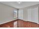 Bedroom with wood-look tile flooring and closet space at 1312 Catalina Blvd, Deltona, FL 32725