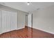 Bedroom with a closet, neutral walls, and attractive wood-look tile flooring at 1312 Catalina Blvd, Deltona, FL 32725