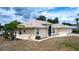 Charming single-story home featuring stucco siding, a two-car garage, and landscaped front yard at 1312 Catalina Blvd, Deltona, FL 32725