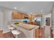 Modern kitchen features stainless steel appliances, updated cabinetry, and a breakfast bar at 1312 Catalina Blvd, Deltona, FL 32725