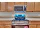 Modern kitchen with stainless steel microwave and oven appliance set at 1312 Catalina Blvd, Deltona, FL 32725