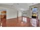 Open-concept living space with sleek tile flooring and vaulted ceilings at 1312 Catalina Blvd, Deltona, FL 32725