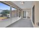 Enclosed back patio with screened windows and a view of the backyard at 1312 Catalina Blvd, Deltona, FL 32725