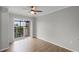 Bright bedroom featuring a private balcony and ample natural light at 136 Blue Point Way # 320, Altamonte Springs, FL 32701