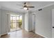Bedroom featuring a ceiling fan and access to a screened balcony, providing a relaxing indoor-outdoor living experience at 136 Blue Point Way # 320, Altamonte Springs, FL 32701