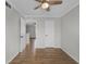 Cozy bedroom featuring a ceiling fan and wood-look floors, creating a comfortable and stylish space at 136 Blue Point Way # 320, Altamonte Springs, FL 32701