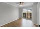 Bright bedroom with wood floors and sliding glass doors at 136 Blue Point Way # 320, Altamonte Springs, FL 32701