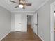 Cozy bedroom featuring a ceiling fan and wood-look floors, creating a comfortable and stylish space at 136 Blue Point Way # 320, Altamonte Springs, FL 32701