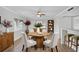 Dining area has a modern chandelier, light walls, and views of the open living spaces at 136 Blue Point Way # 320, Altamonte Springs, FL 32701