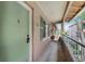 Exterior view of unit with green door, windows, and a patio area at 136 Blue Point Way # 320, Altamonte Springs, FL 32701