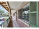 Exterior corridor showcasing the building's architecture and open-air design with view of community pool at 136 Blue Point Way # 320, Altamonte Springs, FL 32701
