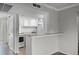 Bright kitchen featuring white cabinets and a breakfast bar for casual dining at 136 Blue Point Way # 320, Altamonte Springs, FL 32701