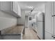 Clean kitchen featuring white appliances and granite countertops at 136 Blue Point Way # 320, Altamonte Springs, FL 32701