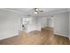 Inviting living room with wood floors, adjacent to a clean white kitchen at 136 Blue Point Way # 320, Altamonte Springs, FL 32701