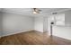 Spacious living room featuring hardwood floors and a ceiling fan at 136 Blue Point Way # 320, Altamonte Springs, FL 32701