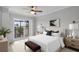 Cozy main bedroom with balcony access, ceiling fan, and natural light at 136 Blue Point Way # 320, Altamonte Springs, FL 32701