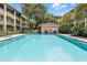 Relaxing community pool with ample seating and lush landscaping at 136 Blue Point Way # 320, Altamonte Springs, FL 32701