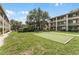 Putting green in a courtyard-like manicured lawn area surrounded by community buildings at 136 Blue Point Way # 320, Altamonte Springs, FL 32701