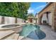 Backyard featuring a beautiful pool, spa, and outdoor fireplace for relaxation and entertainment at 1401 Green Cove Rd, Winter Park, FL 32789