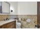 This powder room features patterned tile, a marble countertop and custom sink at 1401 Green Cove Rd, Winter Park, FL 32789