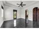 Large bedroom boasts dark marble floors, arched entryways, and abundant natural light at 1401 Green Cove Rd, Winter Park, FL 32789