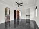 This bedroom boasts dark marble floors, arched entryways, and access to a wet bar at 1401 Green Cove Rd, Winter Park, FL 32789
