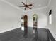Expansive bedroom with dark marble floors, multiple doorways, and bright natural light at 1401 Green Cove Rd, Winter Park, FL 32789