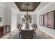 Bright dining room features a decorative ceiling, view of backyard, and seating for eight at 1401 Green Cove Rd, Winter Park, FL 32789