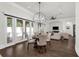 Dining area with wood floors, a modern chandelier, and French doors to the pool at 1401 Green Cove Rd, Winter Park, FL 32789