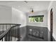 Bright open foyer with marble floors, high ceilings, and iron-railed staircase at 1401 Green Cove Rd, Winter Park, FL 32789