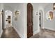 Hallway with arched doorways and decorative lighting at 1401 Green Cove Rd, Winter Park, FL 32789