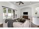 Comfortable living room featuring French doors leading to a pool area and a built-in TV at 1401 Green Cove Rd, Winter Park, FL 32789