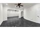 Large living room with dark floors and archways to other rooms at 1401 Green Cove Rd, Winter Park, FL 32789