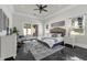 Bright main bedroom with marble floors, stylish furniture, and a sliding door to outdoor access at 1401 Green Cove Rd, Winter Park, FL 32789