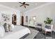 Spacious main bedroom with luxurious marble floors, elegant furniture, and cozy seating area at 1401 Green Cove Rd, Winter Park, FL 32789