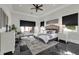 Serene main bedroom with sleek marble floors, tray ceiling, and access to outdoor area at 1401 Green Cove Rd, Winter Park, FL 32789