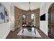 Home office with stone wall accent, decorative lighting, and hardwood floors at 1401 Green Cove Rd, Winter Park, FL 32789