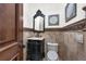 Traditional powder room with decorative mirror and fixtures at 1401 Green Cove Rd, Winter Park, FL 32789