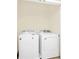 Convenient laundry room featuring a washing machine and dryer in a well-lit space at 1401 Yellow Finch Dr, Davenport, FL 33837
