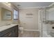 Bathroom with modern vanity, a shower/tub combo, and updated fixtures at 1455 Blue Horizon Dr, Clermont, FL 34714