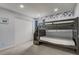 Comfortable bedroom featuring bunk beds with stairs, ample closet space, and neutral carpet flooring at 1455 Blue Horizon Dr, Clermont, FL 34714