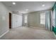 Bright bedroom featuring neutral carpet, recessed lights, and natural light through two windows at 1455 Blue Horizon Dr, Clermont, FL 34714