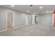 The bonus room boasts neutral carpeting and multiple access points to other rooms at 1455 Blue Horizon Dr, Clermont, FL 34714
