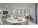 Open plan with dining area and living room filled with natural light at 1455 Blue Horizon Dr, Clermont, FL 34714