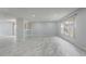 Spacious living room with modern tile flooring and a large window at 1455 Blue Horizon Dr, Clermont, FL 34714